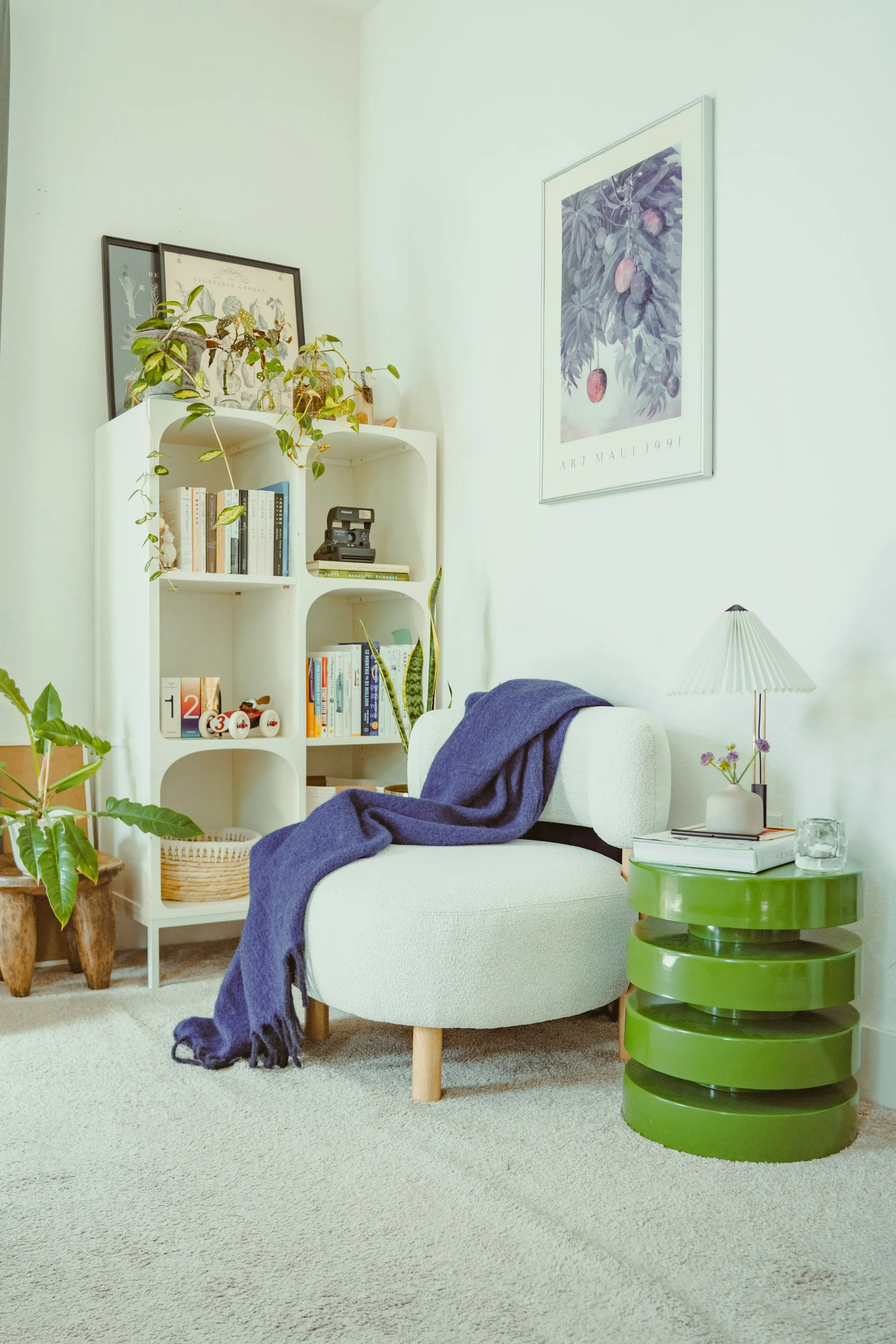 A reading corner with an armchair and a bookshelf